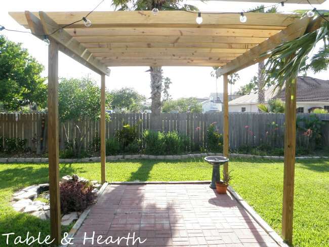 Save thousands by building your own DIY pergola with this simple design and tutorial from Table & Hearth!