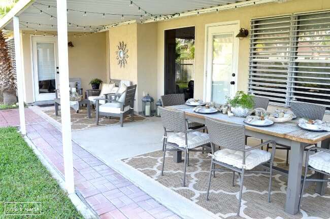 DIY Farmhouse Table - Gorgeous! This blogger used discarded old lumber to make a rustic statement dining table for their outdoor patio! 