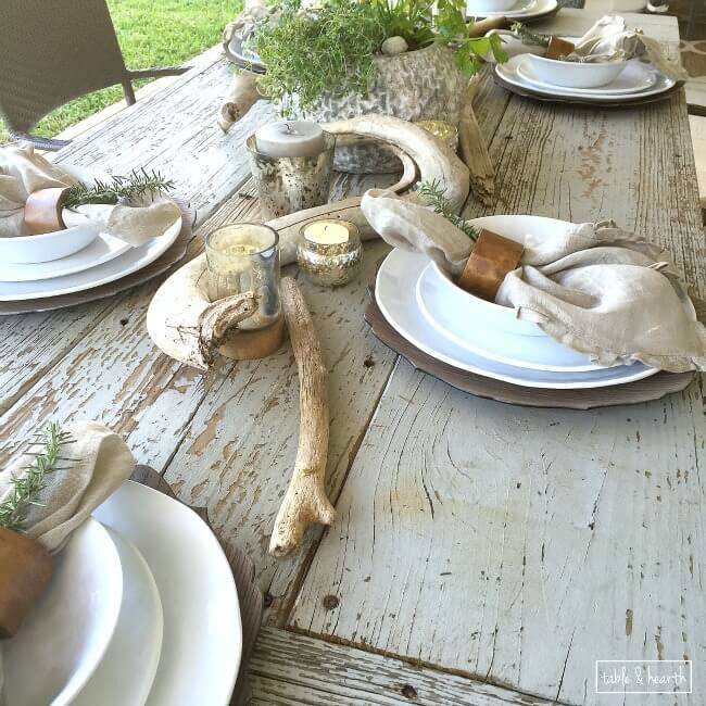 DIY Farmhouse Table - Gorgeous! This blogger used discarded old lumber to make a rustic statement dining table for their outdoor patio! 