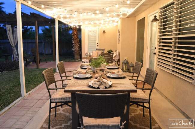 DIY Farmhouse Table - Gorgeous! This blogger used discarded old lumber to make a rustic statement dining table for their outdoor patio! 