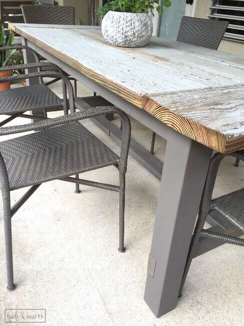 DIY Farmhouse Table - Gorgeous! This blogger used discarded old lumber to make a rustic statement dining table for their outdoor patio! 