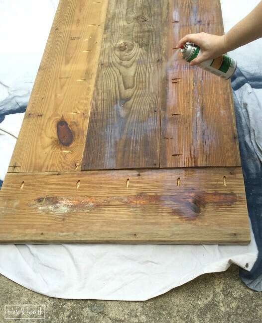 DIY Farmhouse Table - Gorgeous! This blogger used discarded old lumber to make a rustic statement dining table for their outdoor patio!