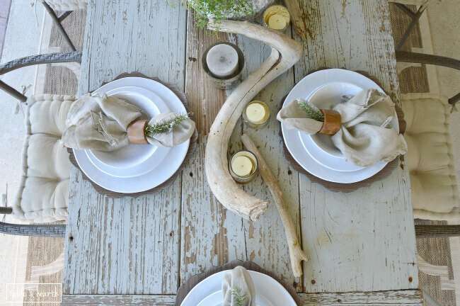 DIY Farmhouse Table - Gorgeous! This blogger used discarded old lumber to make a rustic statement dining table for their outdoor patio! 