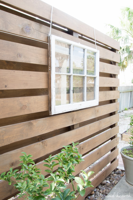 Beautiful!! How to build a DIY privacy wall to polish off your outdoor space and provide needed privacy. www.tableandhearth.com