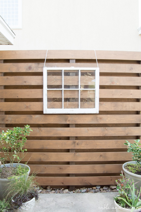 Beautiful!! How to build a DIY privacy wall to polish off your outdoor space and provide needed privacy. www.tableandhearth.com