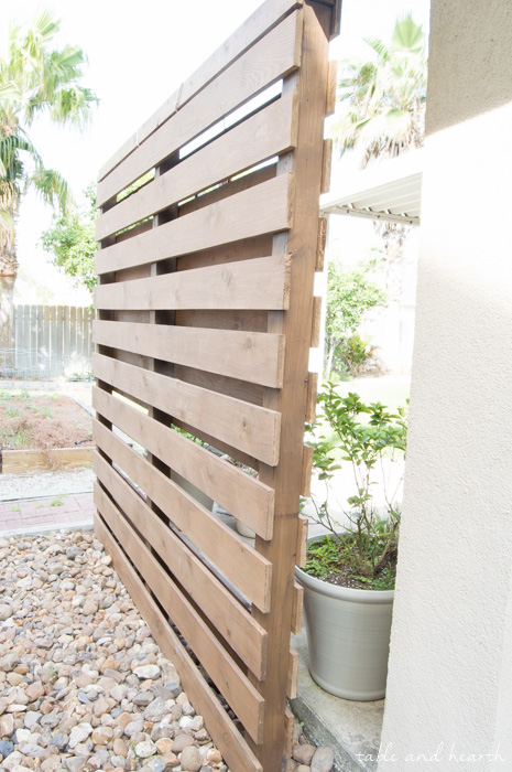 Beautiful!! How to build a DIY privacy wall to polish off your outdoor space and provide needed privacy. www.tableandhearth.com