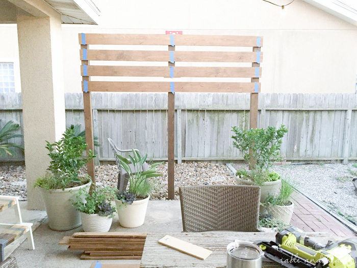 Beautiful!! How to build a DIY privacy wall to polish off your outdoor space and provide needed privacy. www.tableandhearth.com