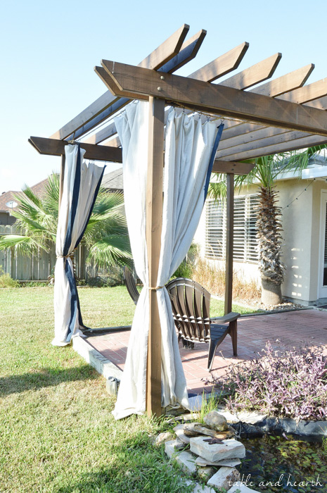 High Style, Low Budget - Bring elegance and luxury to your outdoor space without spending a fortune by making these DIY No-Sew Outdoor Curtains! www.tableandhearth.com
