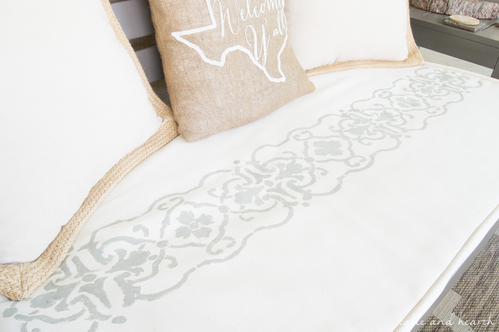 Update a boring cushion with an easy and beautiful stencil!! www.tableandhearth.com