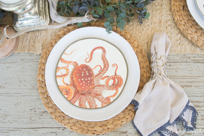 Coastal Summer Patio Decor - Rustic touches and a little whimsy bring this beautiful backyard patio to life for a summer party, night or day! www.tableandhearth.com