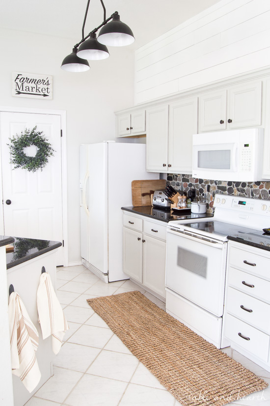 BEAUTIFUL Gray Kitchen! This kitchen went from pink pickled oak mess to a perfect light gray rustic farmhouse-inspired space full of character. Cabinet color is Sherwin-Williams "Repose Gray" www.tableandhearth.com