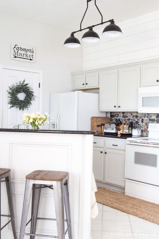 BEAUTIFUL Gray Kitchen! This kitchen went from pink pickled oak mess to a perfect light gray rustic farmhouse-inspired space full of character. Cabinet color is Sherwin-Williams "Repose Gray" www.tableandhearth.com