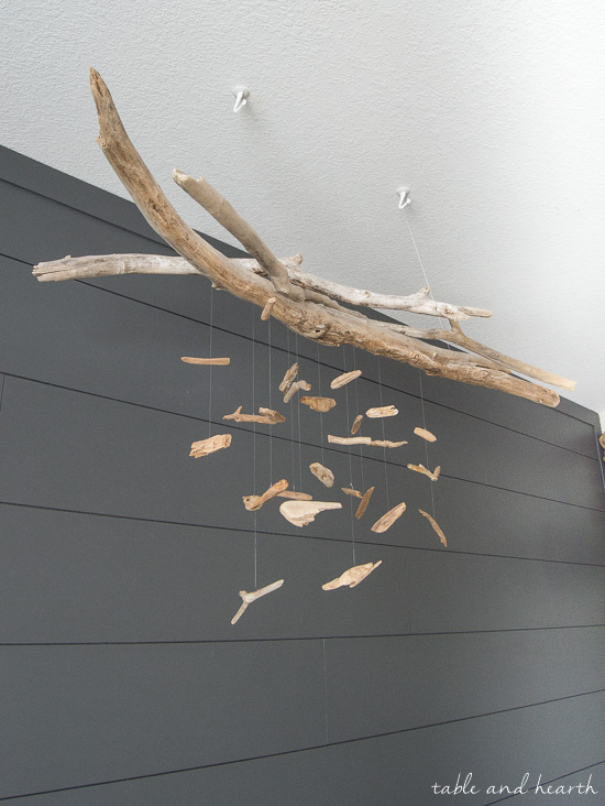 Beautiful and easy for a coastal nursery! DIY driftwood mobile at www.tableandhearth.com