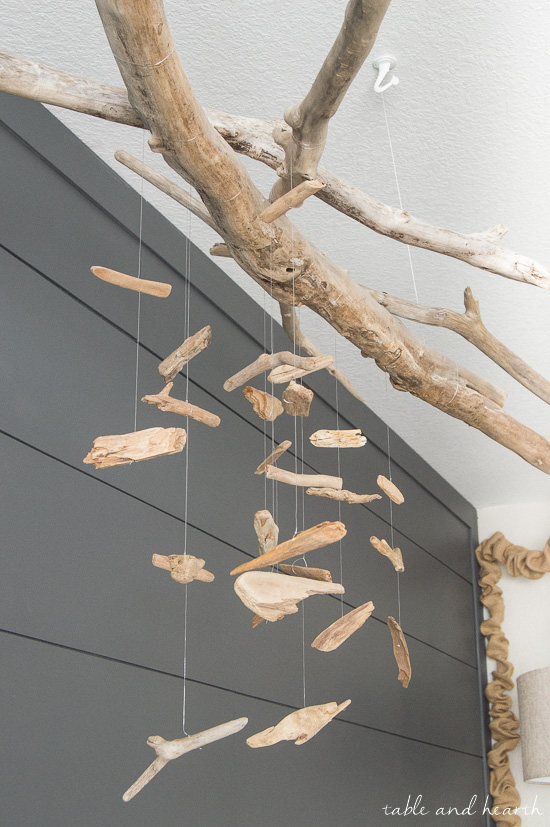 Beautiful and easy for a coastal nursery! DIY driftwood mobile at www.tableandhearth.com