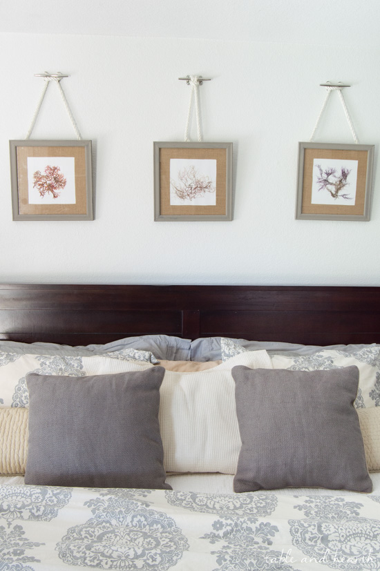 Such a pretty way to hang pictures! DIY Nautical Rope Picture Hangers