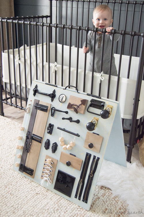 Keep your little one occupied while keeping your style too, check out this stylish rustic baby busy board from www.tableandhearth.com!