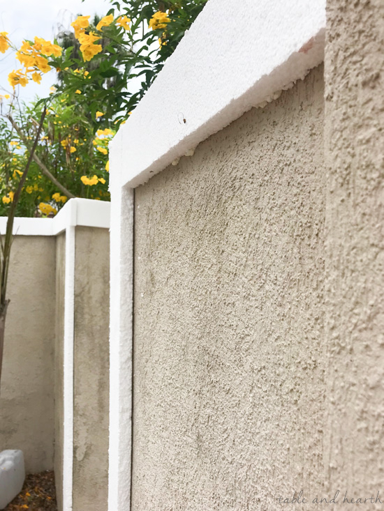 See how this blogger had a stucco wall border added to update a crumbling boring stucco wall! www.tableandhearth.com