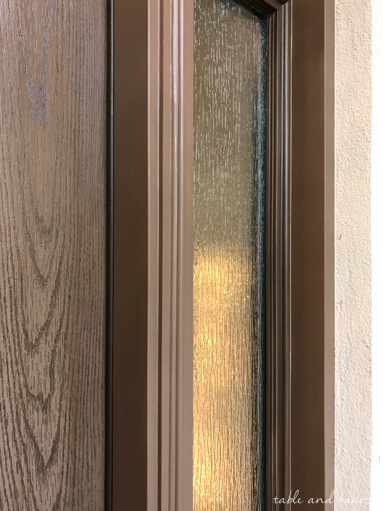 Installing a new entry door unit on a stucco home can be a daunting project. See how it went for this blogger's crew as they installed a beautiful new unit on a mid-90s stucco home! #thermatrudoors #entrydoor #wooddoor #fiberglassdoor www.tableandhearth.com