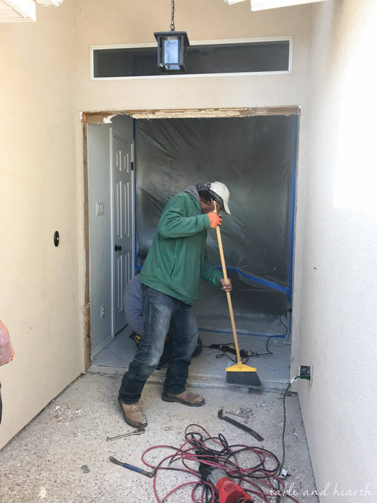 Installing a new entry door unit on a stucco home can be a daunting project. See how it went for this blogger's crew as they installed a beautiful new unit on a mid-90s stucco home! #thermatrudoors #entrydoor #wooddoor #fiberglassdoor www.tableandhearth.com