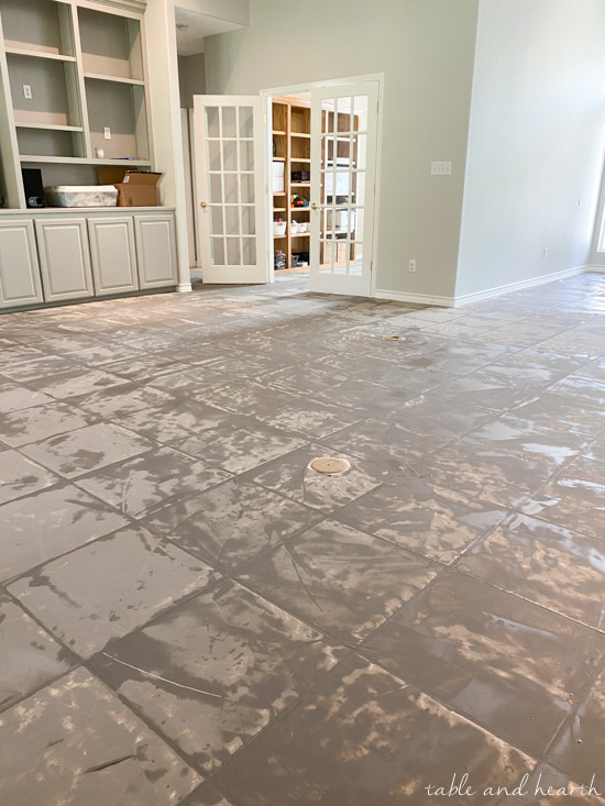 Having luxury vinyl plank in a light wood tone installed over ceramic tile in our new home