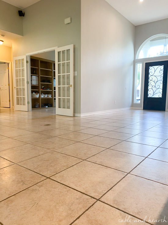 Having luxury vinyl plank in a light wood tone installed over ceramic tile in our new home