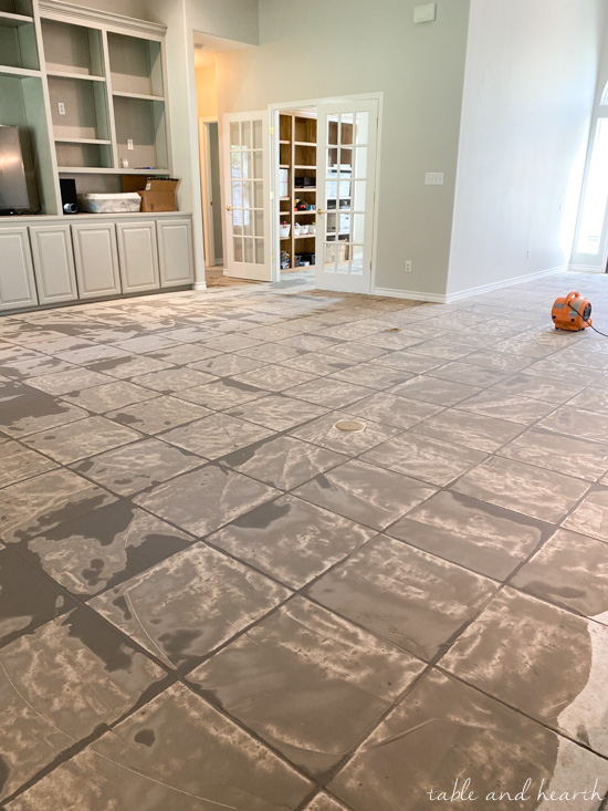 Having luxury vinyl plank in a light wood tone installed over ceramic tile in our new home